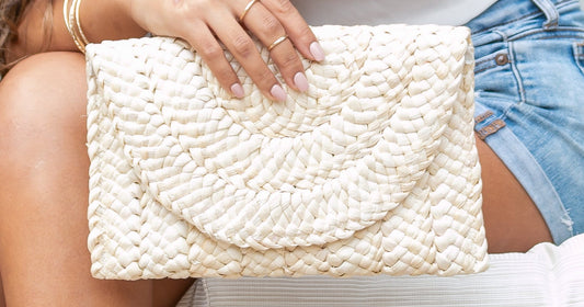 women's jeans styles guide featuring a foldover straw clutch accessory for curvy women