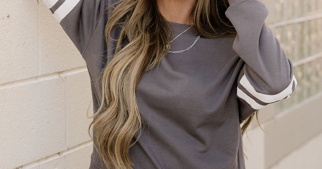 Cute outfits under $50 women varsity striped sleeve loose sweatshirt perfect for spring