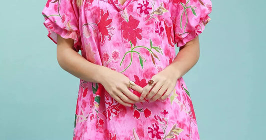 women's spring outfit ideas 2026 featuring women in a floral ruffle hem mini dress
