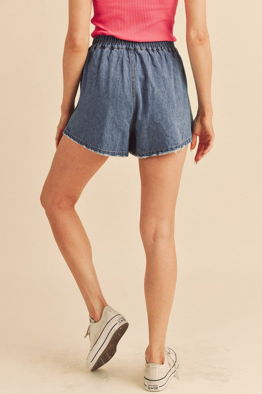 Aemi + Co Frayed Hem Elastic Waist Denim Shorts in Medium - us.meeeshop