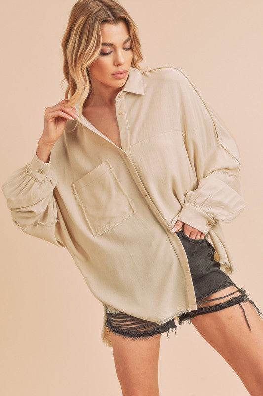 Aemi + Co Raw Edge Exposed Seam Collared Neck Long Sleeve Shirt in Oatmeal - us.meeeshop