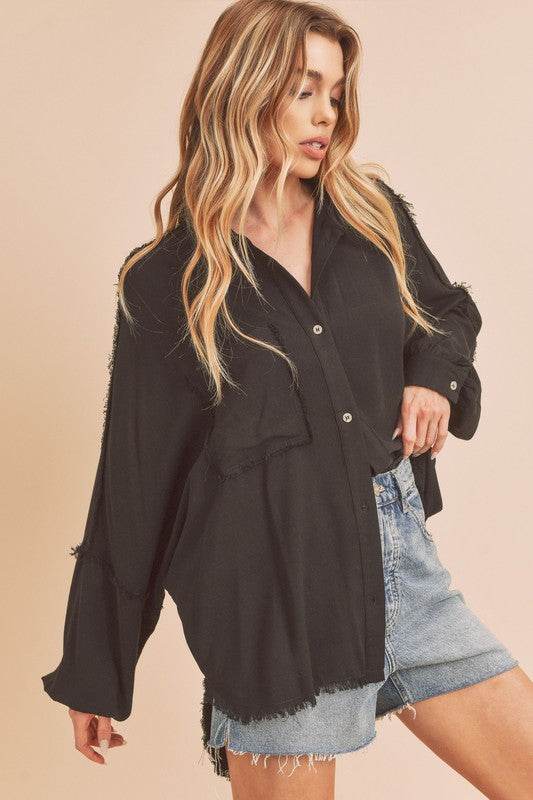 Aemi + Co Raw Edge Exposed Seam Collared Neck Long Sleeve Shirt in Black - us.meeeshop