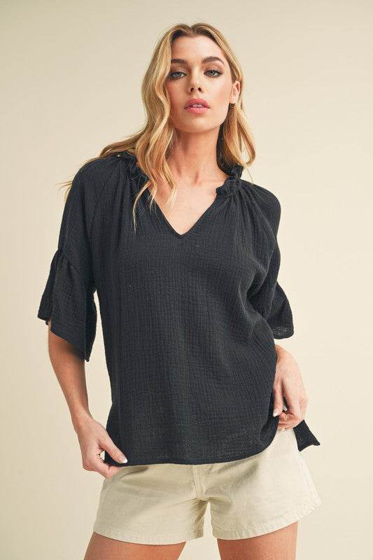 Aemi + Co Side Slit Notched Ruffled Half Sleeve Blouse in Black - us.meeeshop