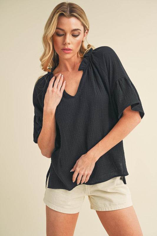 Aemi + Co Side Slit Notched Ruffled Half Sleeve Blouse in Black - us.meeeshop