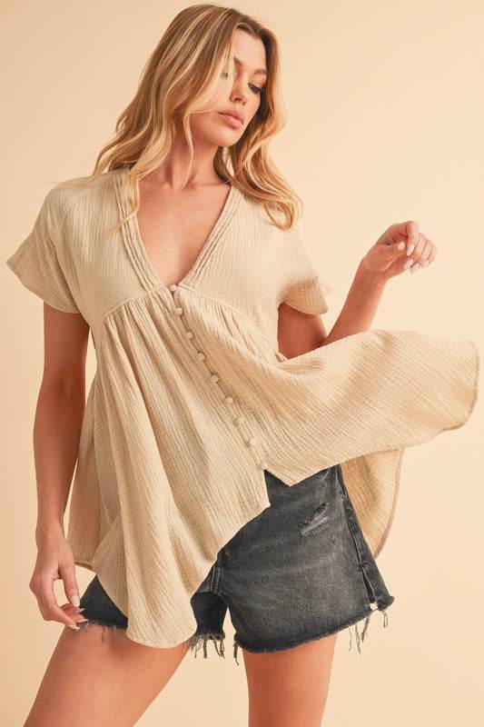 Aemi + Co Tuck Detail V-Neck Short Sleeve Blouse in Oatmeal - us.meeeshop