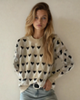 Brynlee Geometric Heart Print Ribbed Trim Loose Sweater