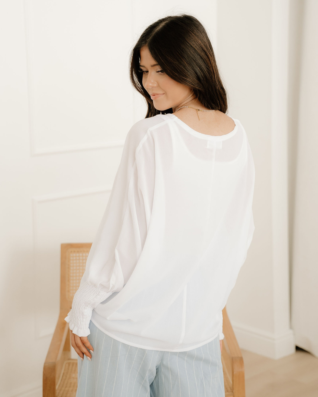 Indie & Co. Marley Smocked Cuffs Semi Sheer Long Sleeve Dolman Blouse view 6 - Marley Pleated Smocked Mini Dress