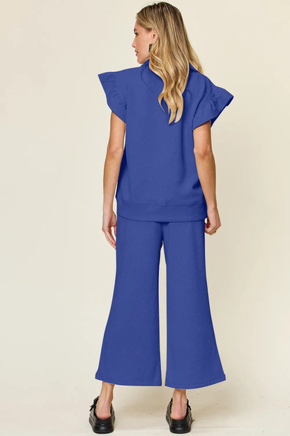 Trendsi Double Take Texture Ruffle Short Sleeve Top and Drawstring Wide Leg Pants Set in Cream view 11 - Double Take Topic
